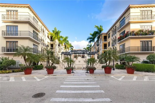 a view of a building with potted plants