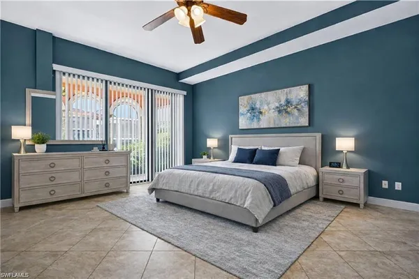 a spacious bedroom with a large bed and a window