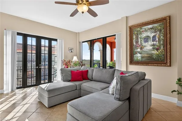 a living room with furniture and a large window