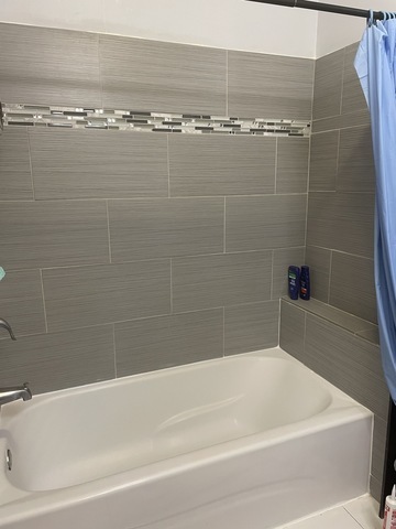 6335 Cermak Road Berwyn, IL 60402 - Photo 5 of 6 a bathroom with a shower and a sink