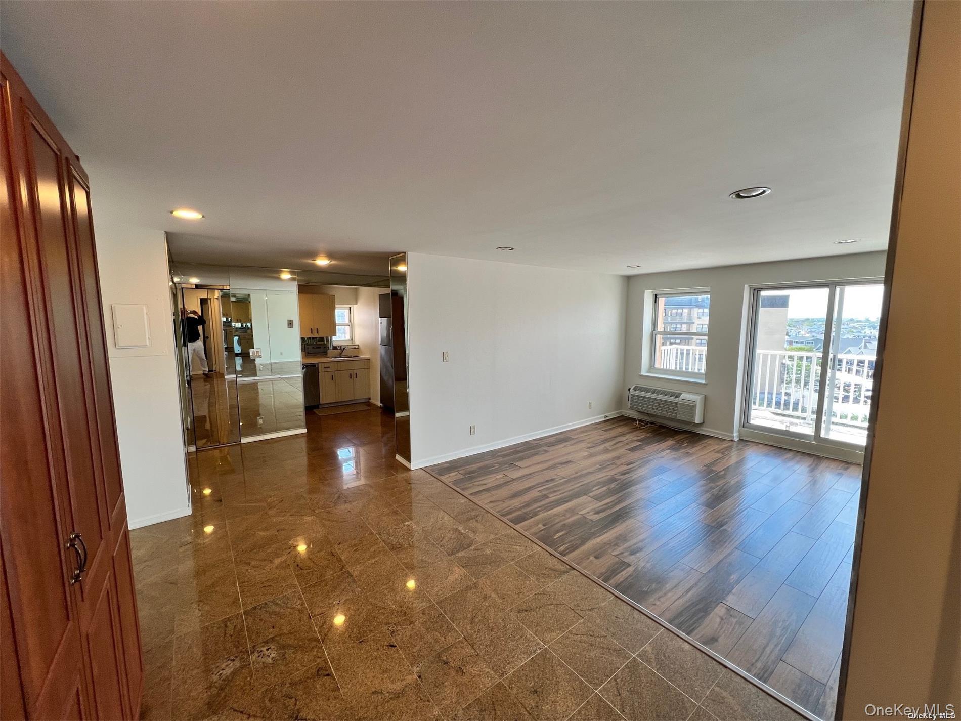 2 Richmond Road, Unit PH 6R Lido Beach, NY 11561 - Photo 11 of 19 a view of a big room with windows and chandelier