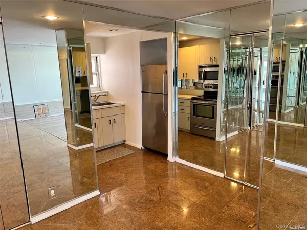 a kitchen with stainless steel appliances a refrigerator and a sink