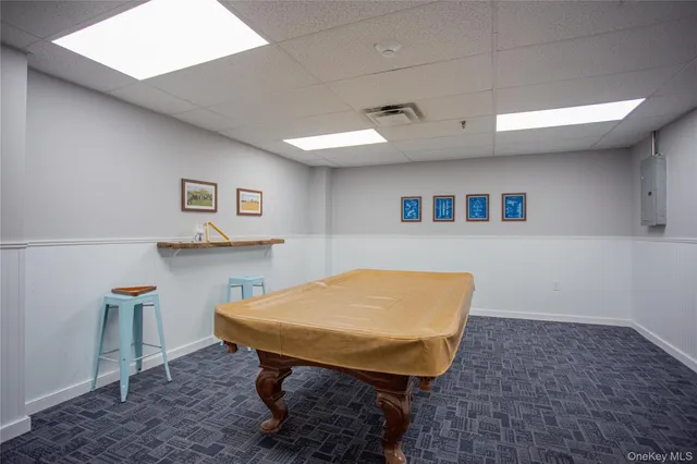 a view of a room with furniture and wooden floor