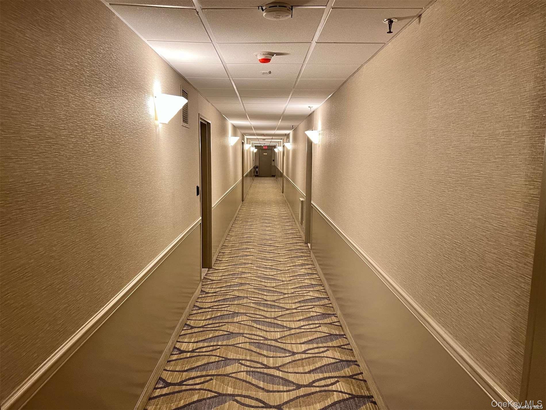 2 Richmond Road, Unit PH 6R Lido Beach, NY 11561 - Photo 7 of 19 a view of a hallway with wooden floor