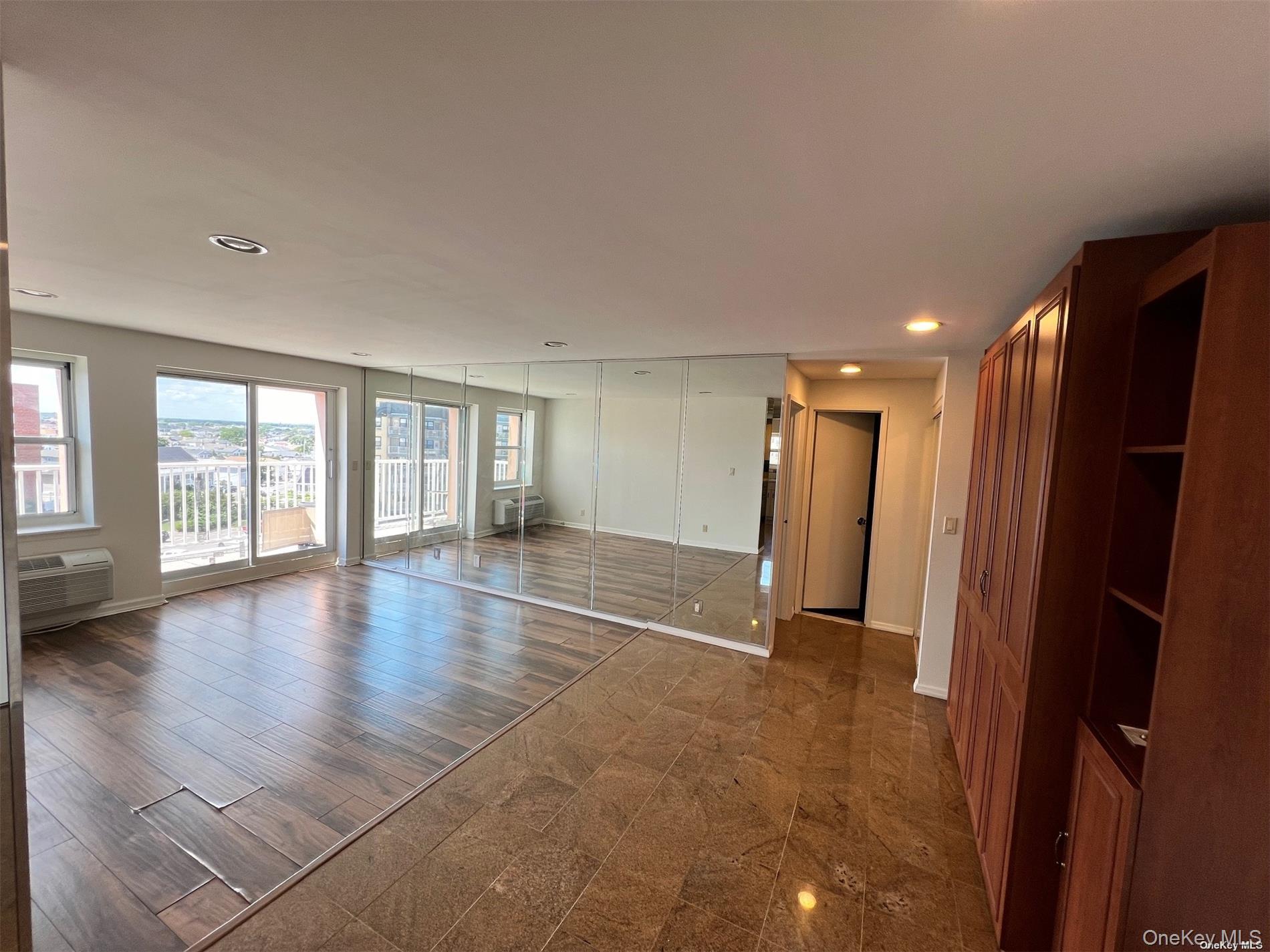 2 Richmond Road, Unit PH 6R Lido Beach, NY 11561 - Photo 8 of 19 wooden floor in an empty room with a window
