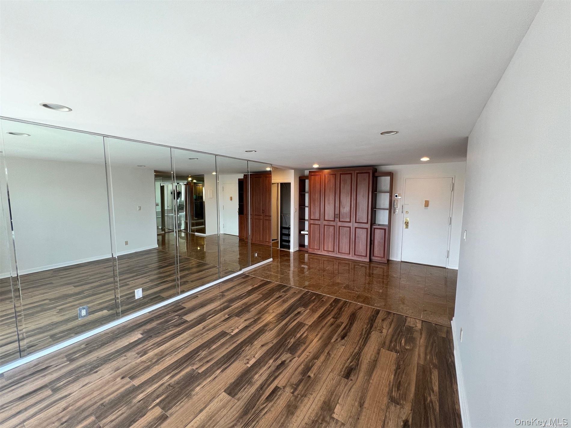 2 Richmond Road, Unit PH 6R Lido Beach, NY 11561 - Photo 10 of 19 a view of a room with wooden floor and fence