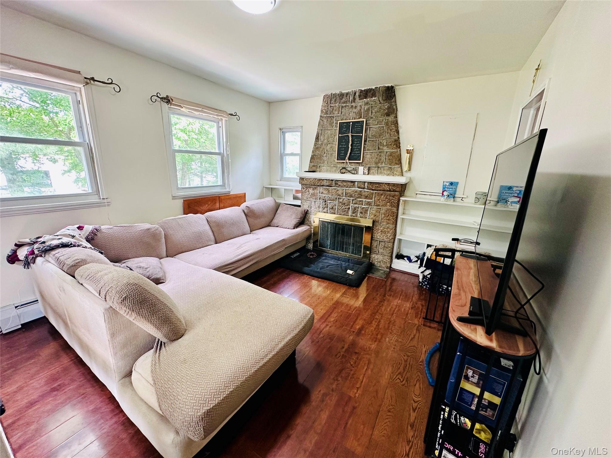 15 Pops Road Cortlandt Manor, NY 10567 - Photo 7 of 14 a living room with furniture and a fireplace