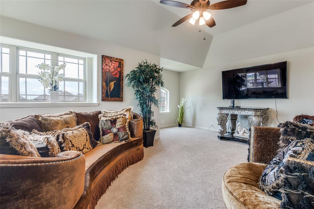 3822 Myrtle Way Kaufman, TX 75142 - Photo 23 of 39 a bedroom with furniture and a flat screen tv