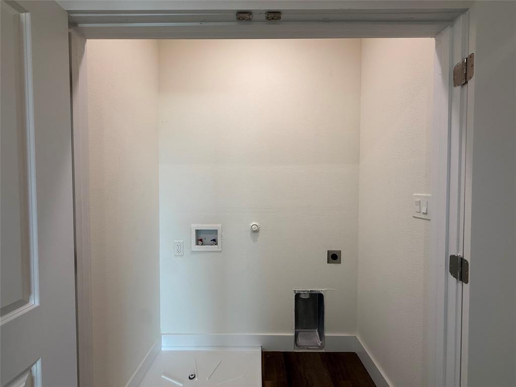 373 Buck Ridge Drive Frisco, TX 75068 - Photo 23 of 24 Bathroom featuring a shower/tub combination, wall-mounted showerhead, and wood-finish flooring