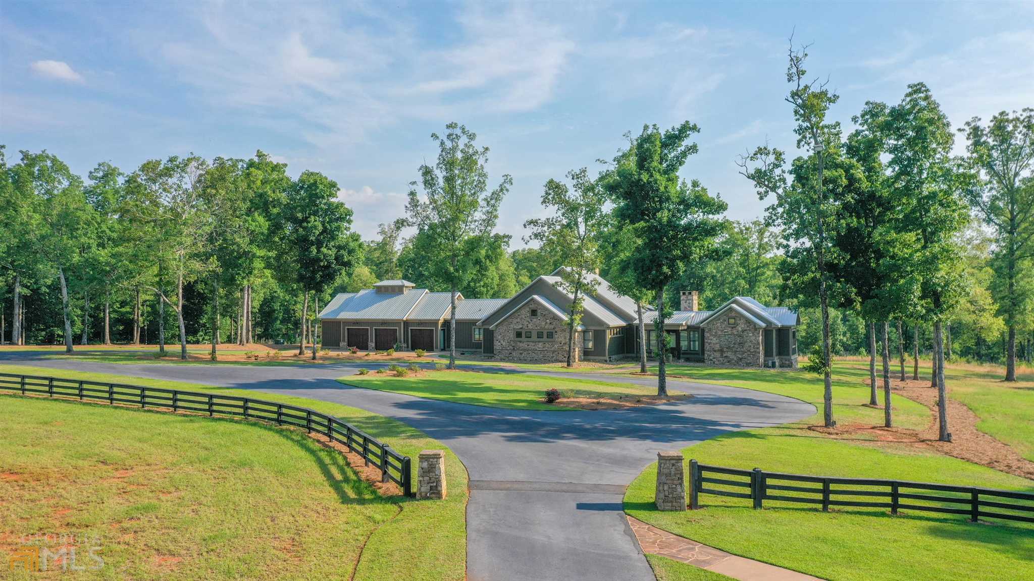 190 Harmony Road Eatonton, GA 31024 - Photo 1 of 1 a view of an house with swimming pool and yard