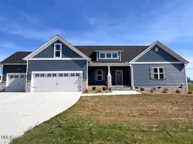 147 Seahawk Way Zebulon, NC 27597 - Photo 1 of 23 a front view of a house with a yard