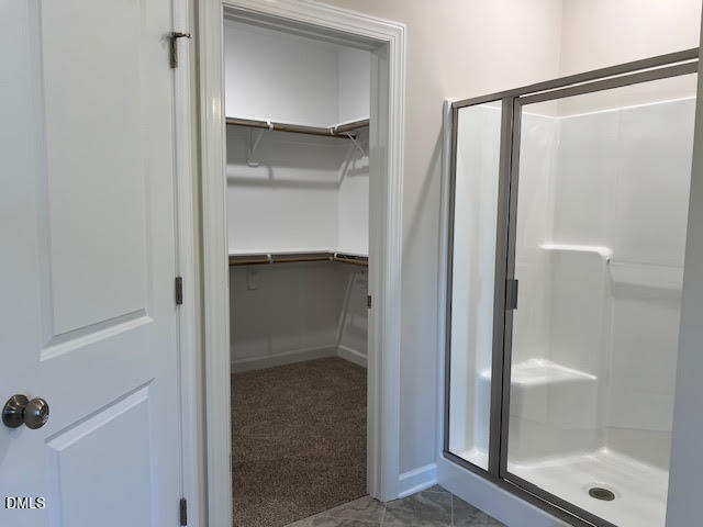 147 Seahawk Way Zebulon, NC 27597 - Photo 12 of 23 a bathroom with a glass shower door