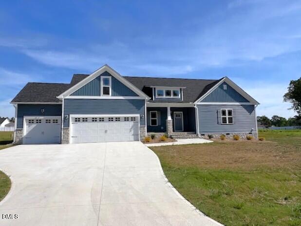 147 Seahawk Way Zebulon, NC 27597 - Photo 2 of 23 a front view of a house with a yard