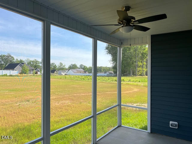 147 Seahawk Way Zebulon, NC 27597 - Photo 21 of 23 a view of a livingroom with a ceiling fan and a large window