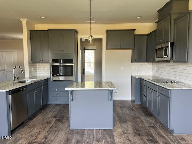 147 Seahawk Way Zebulon, NC 27597 - Photo 7 of 23 a large kitchen with stainless steel appliances a large counter top a stove a sink and a refrigerator