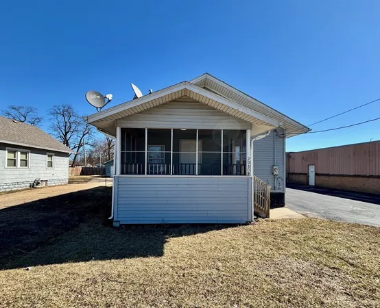 a kitchen with granite countertop wooden floors a stove and wooden cabinets