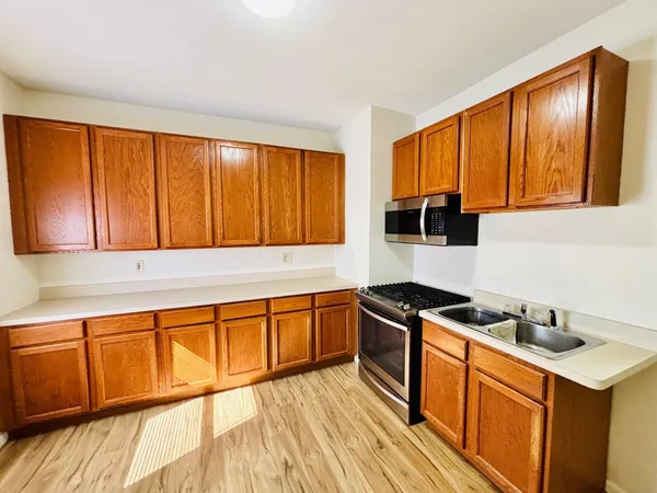 a bathroom with a shower and a sink