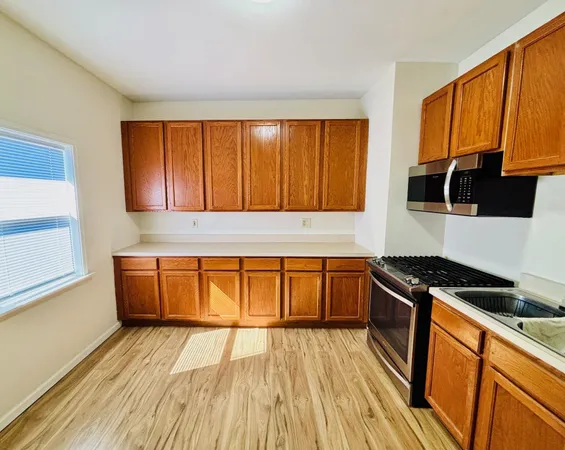 a view of a room with wooden floor and small space