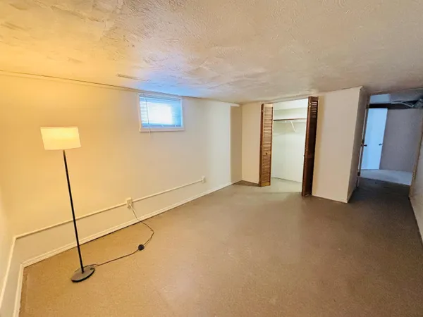 a bathroom with a sink mirror vanity and toilet