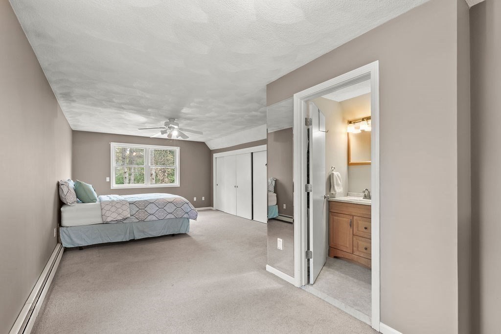 732 Hickory Road North Attleboro, MA 02760 - Photo 12 of 41 a spacious bedroom with a bed and a couch