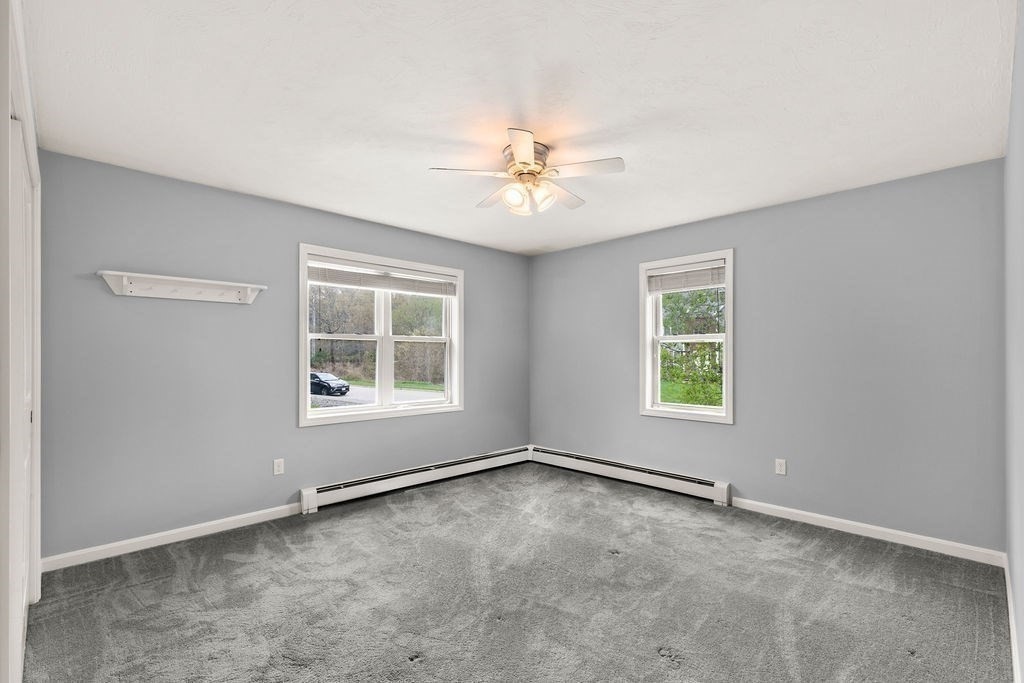 732 Hickory Road North Attleboro, MA 02760 - Photo 16 of 41 an empty room with a window and a ceiling fan