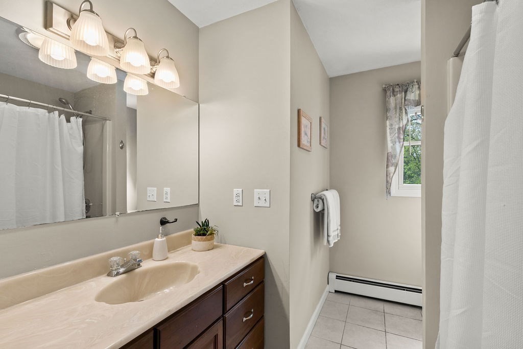 732 Hickory Road North Attleboro, MA 02760 - Photo 21 of 41 a bathroom with a sink vanity granite and a mirror
