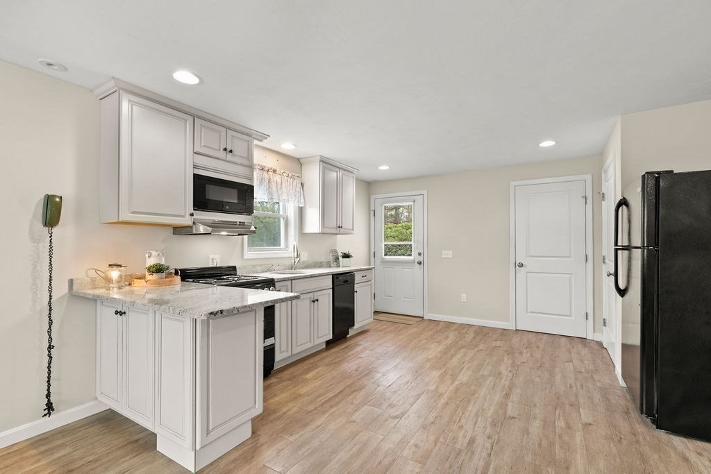 732 Hickory Road North Attleboro, MA 02760 - Photo 22 of 41 a kitchen with stainless steel appliances a refrigerator stove and microwave