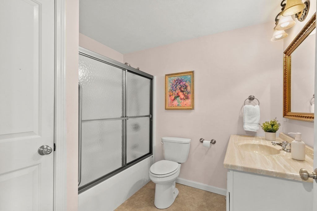 732 Hickory Road North Attleboro, MA 02760 - Photo 26 of 41 a white toilet sitting next to a bathroom sink