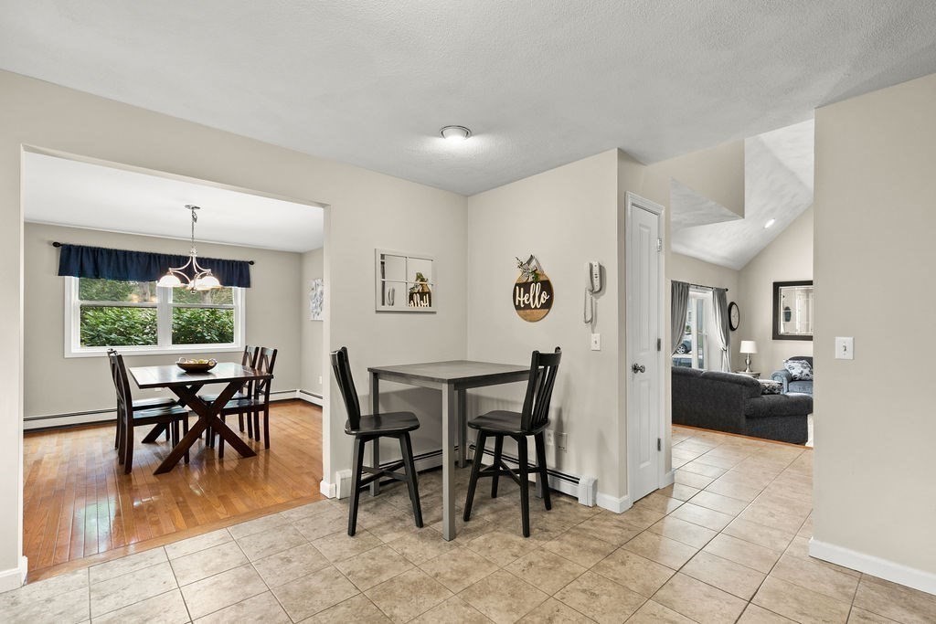 732 Hickory Road North Attleboro, MA 02760 - Photo 5 of 41 a view of a dining room with furniture and a potted plant