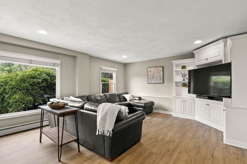 732 Hickory Road North Attleboro, MA 02760 - Photo 8 of 41 a living room with furniture and a flat screen tv
