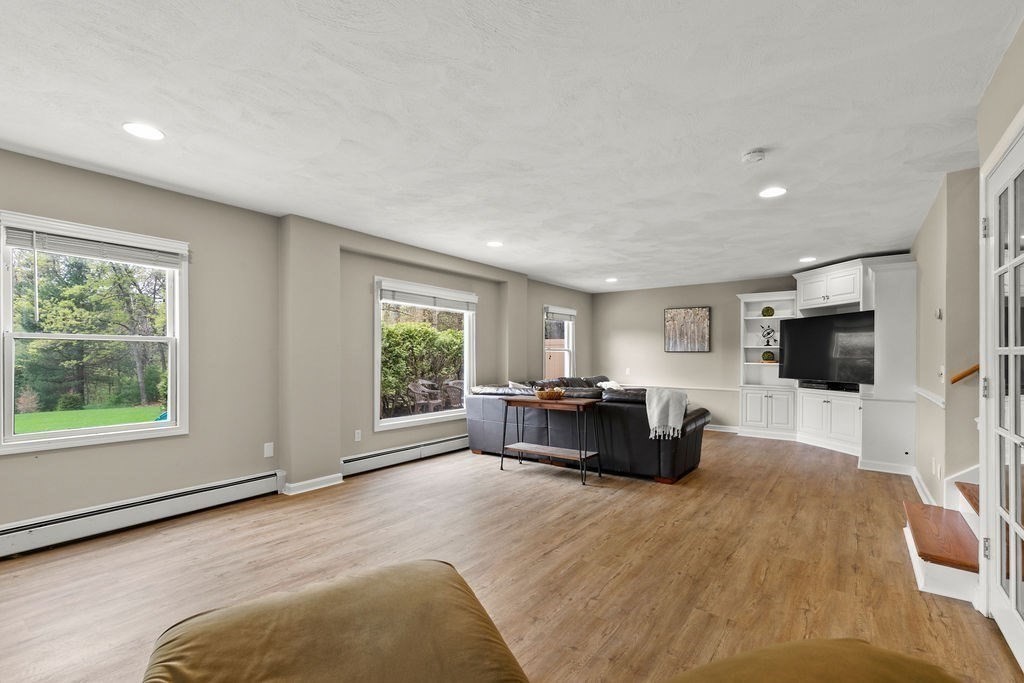 732 Hickory Road North Attleboro, MA 02760 - Photo 10 of 41 a living room with furniture and a flat screen tv