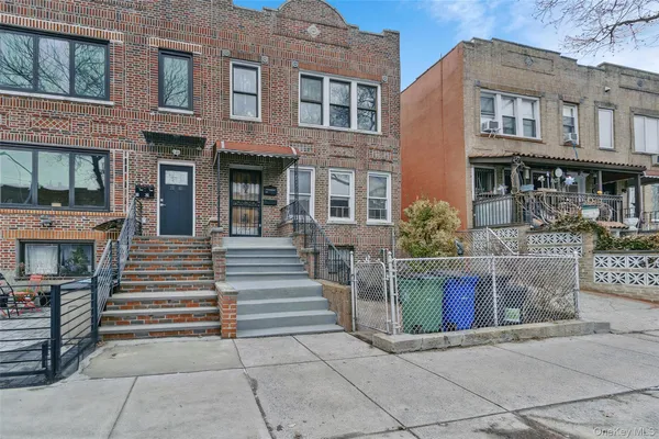 a front view of a brick building with many windows