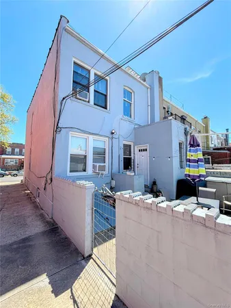 a building outdoor space with patio furniture and wooden floor