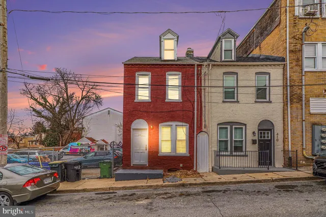 a car parked in front of a house