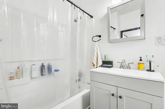 a kitchen with stainless steel appliances a stove a sink and a microwave