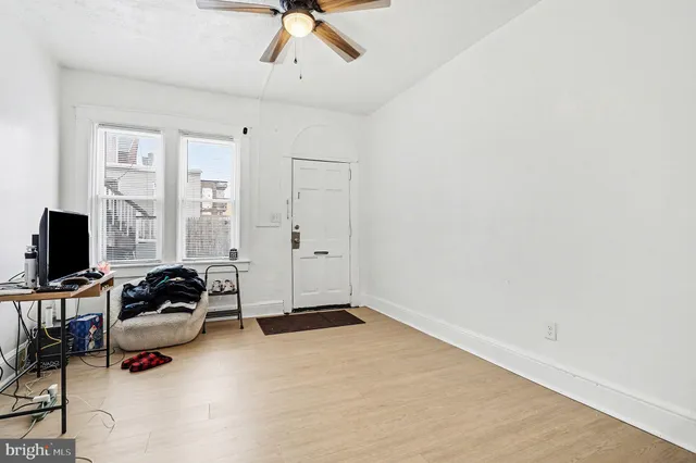 a view of a room with wooden floor