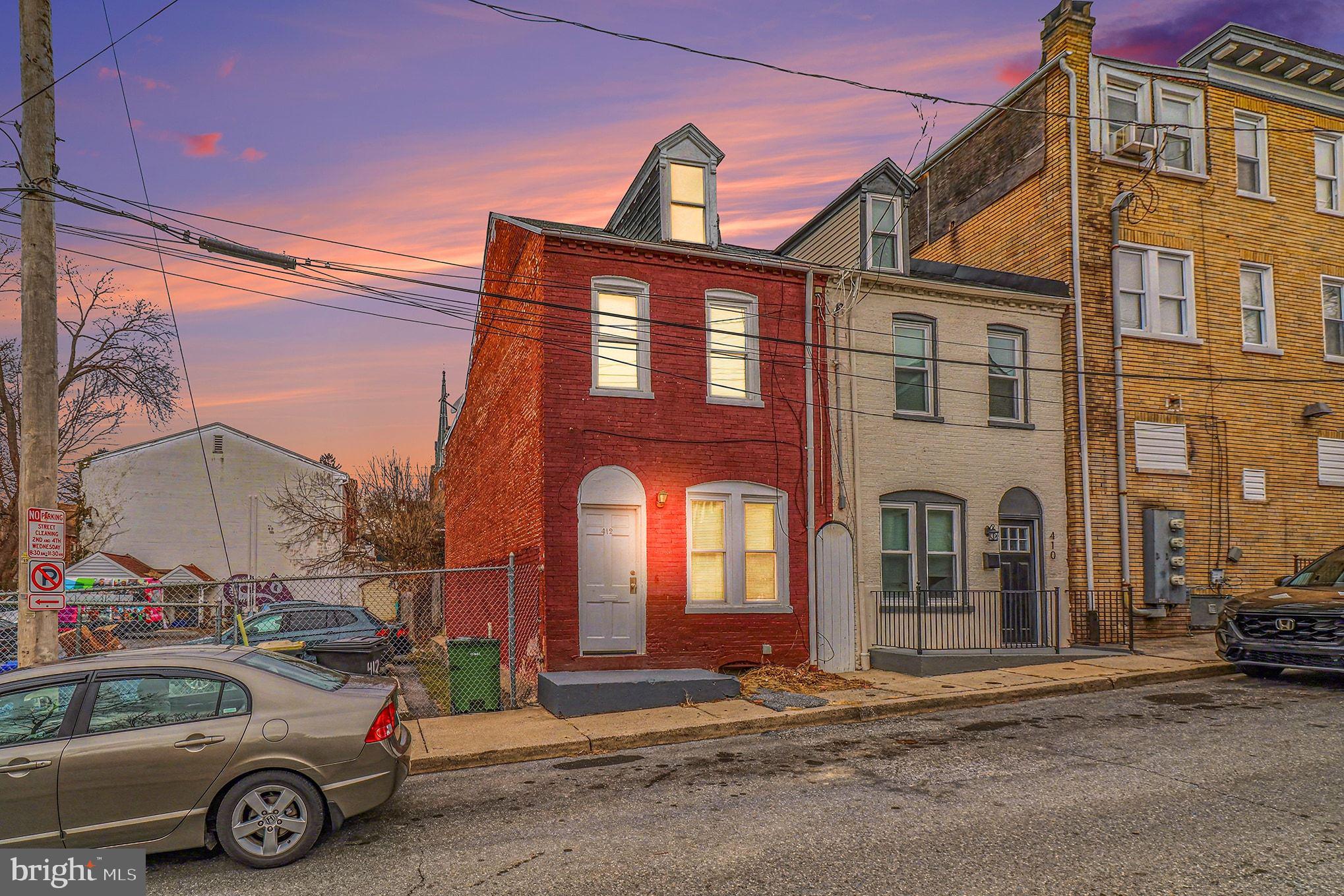 412 Locust Street Lancaster, PA 17602 - Photo 2 of 32 a car parked in front of a house