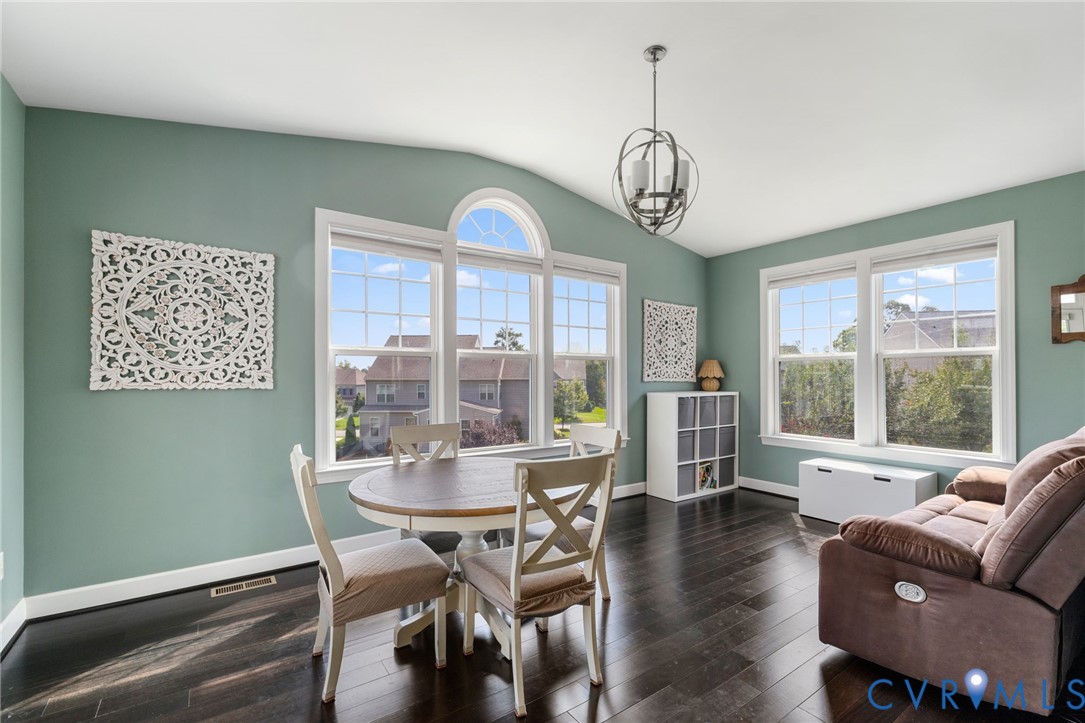 12008 Stable Ridge Terrace Glen Allen, VA 23059 - Photo 12 of 38 a view of a dining room with furniture large windows and wooden floor