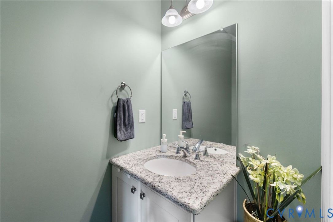 12008 Stable Ridge Terrace Glen Allen, VA 23059 - Photo 17 of 38 a bathroom with a granite countertop sink and a mirror