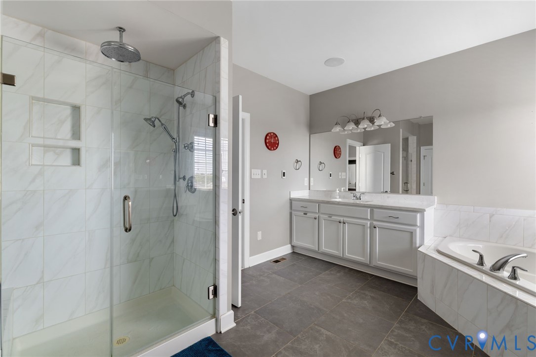 12008 Stable Ridge Terrace Glen Allen, VA 23059 - Photo 21 of 38 a bathroom with a granite countertop sink a toilet a vanity and shower