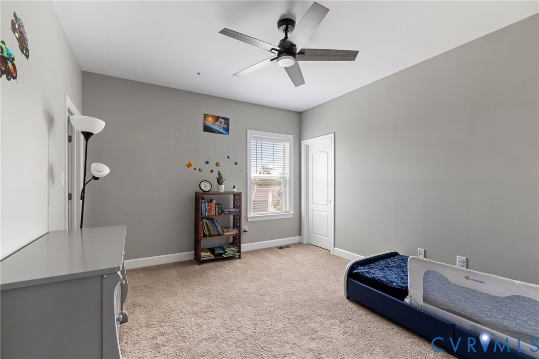 12008 Stable Ridge Terrace Glen Allen, VA 23059 - Photo 22 of 38 a view of a livingroom with furniture and a ceiling fan