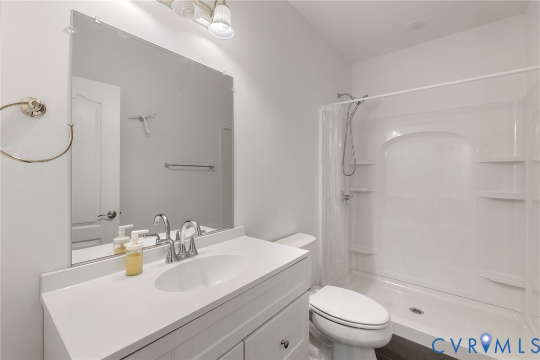 12008 Stable Ridge Terrace Glen Allen, VA 23059 - Photo 32 of 38 a bathroom with a sink toilet and shower