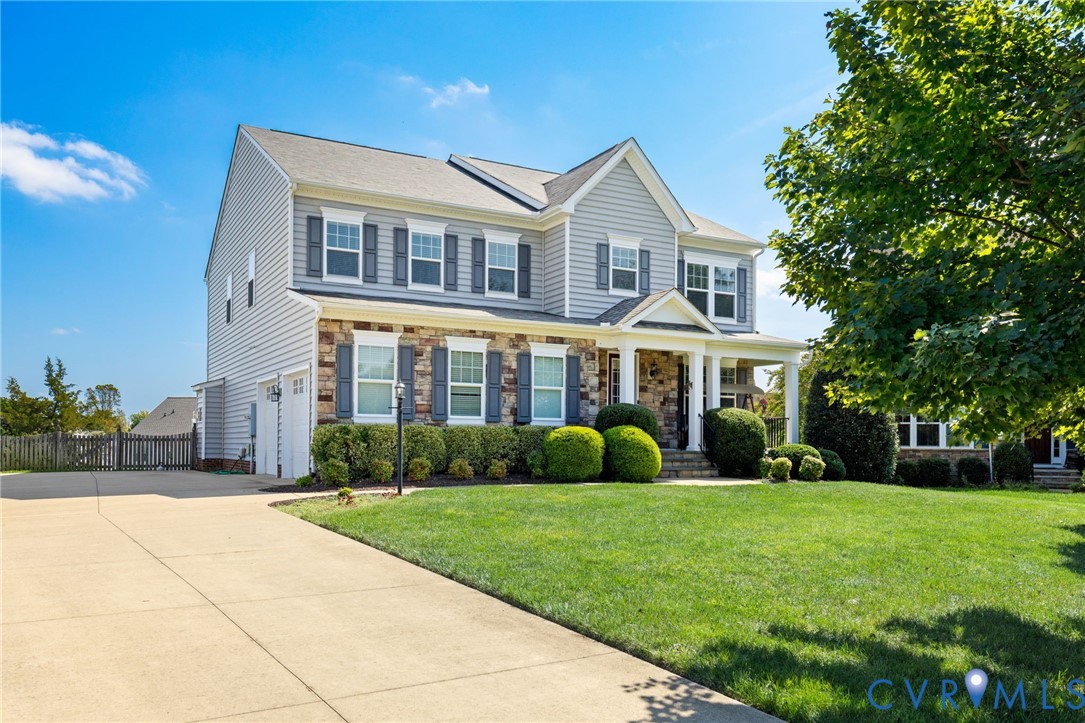 12008 Stable Ridge Terrace Glen Allen, VA 23059 - Photo 37 of 38 a front view of a house with a yard