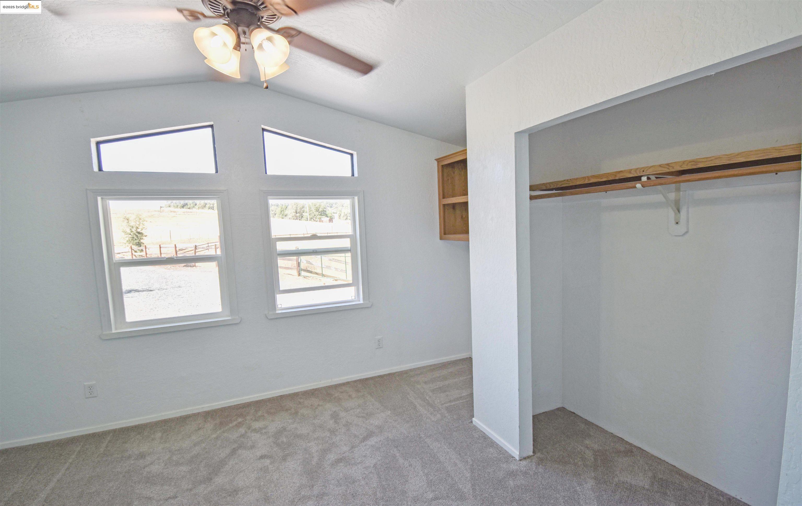 17390 Campbells Flat Road Sonora, CA 95370 - Photo 17 of 37 a view of an empty room with a window