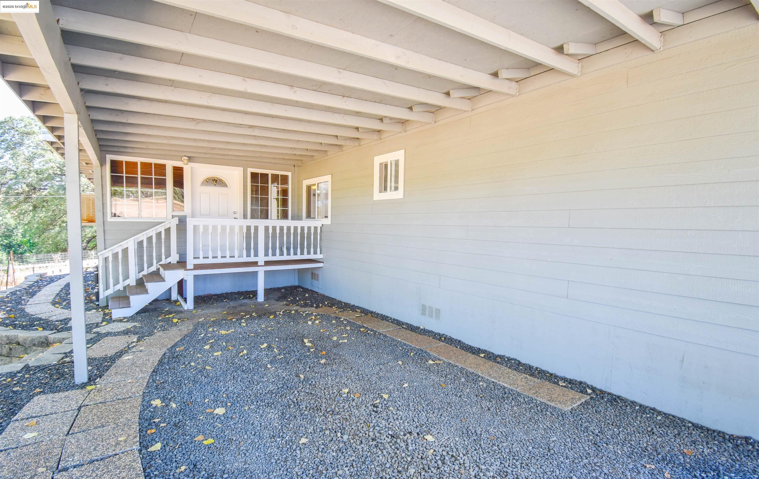 17390 Campbells Flat Road Sonora, CA 95370 - Photo 29 of 37 a view of a house with backyard and deck