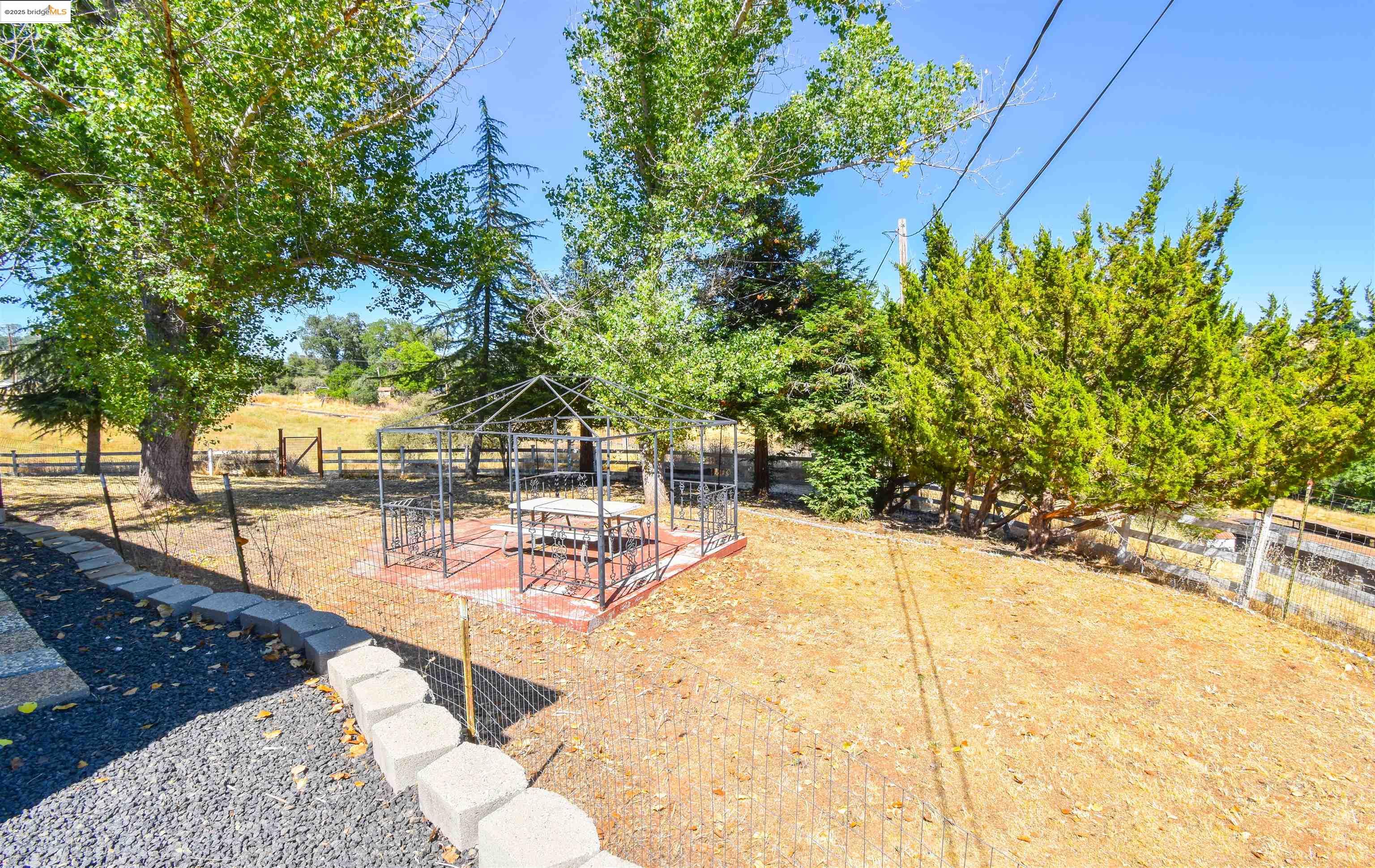 17390 Campbells Flat Road Sonora, CA 95370 - Photo 33 of 37 a view of a swimming pool with a patio
