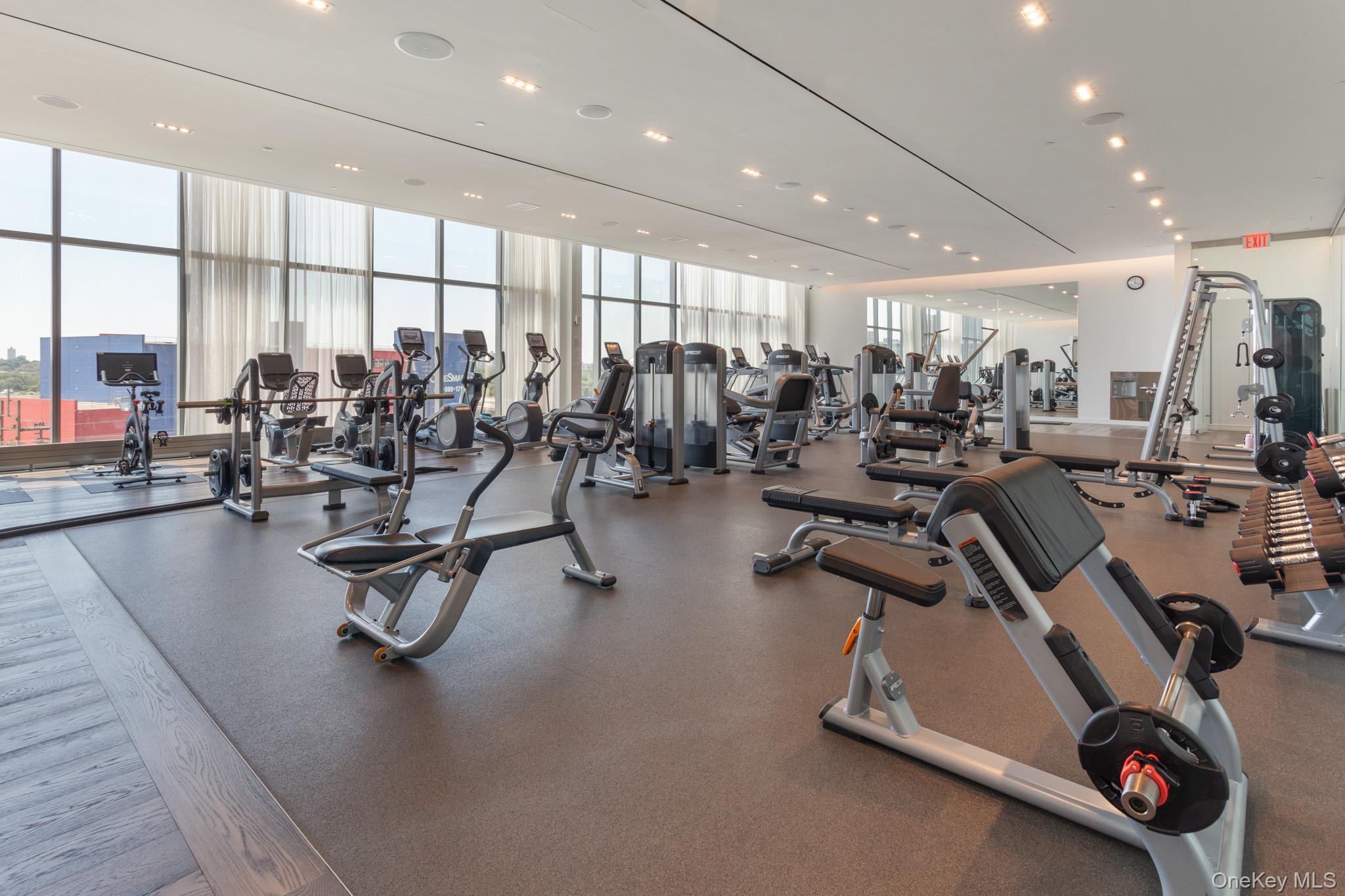 131-01 40 Road, Unit 17S Queens, NY 11354 - Photo 11 of 21 a view of a room with gym equipment