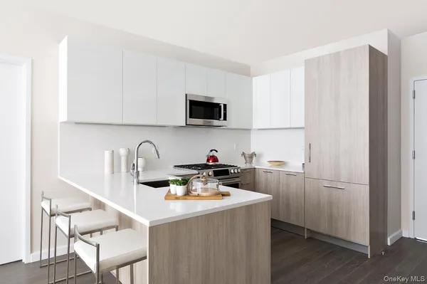 a kitchen with a sink a stove and a refrigerator