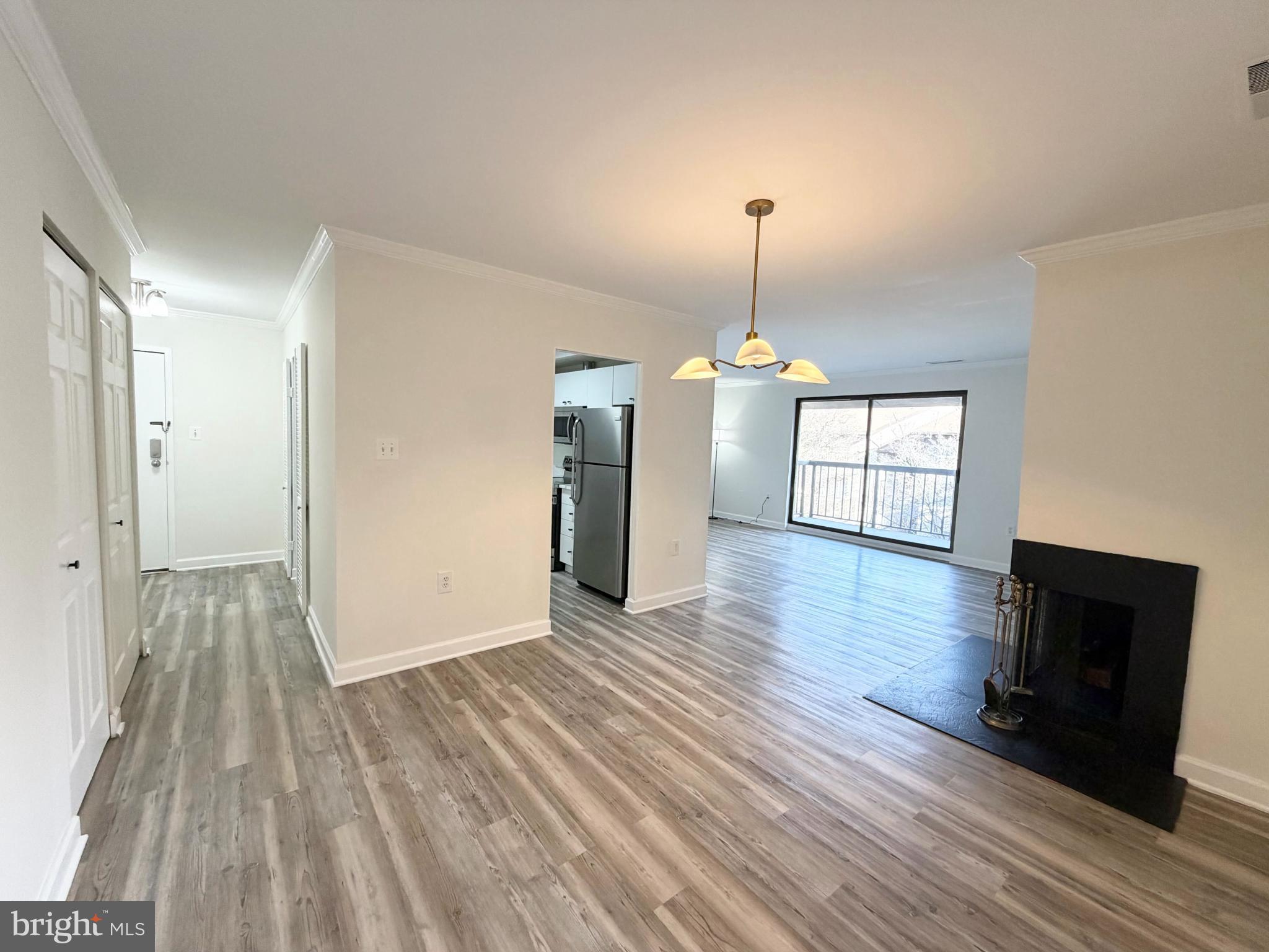 10024 Stedwick Road, Unit 301 Gaithersburg, MD 20886 - Photo 12 of 17 Spacious living area with natural light.