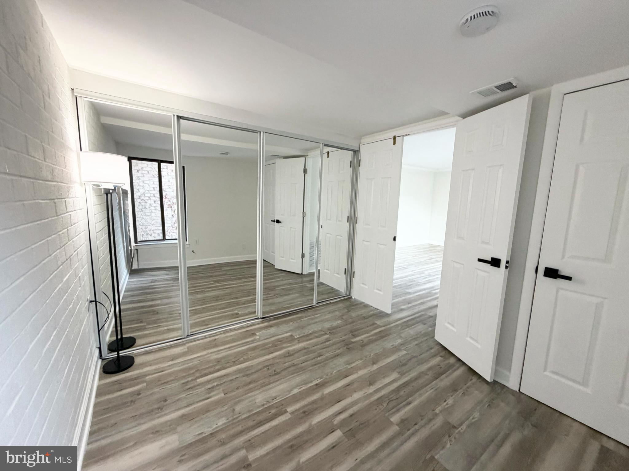 10024 Stedwick Road, Unit 301 Gaithersburg, MD 20886 - Photo 16 of 17 Bright, airy space with mirrored closet doors.